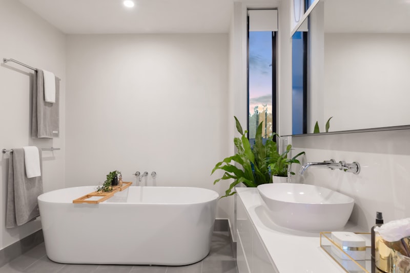 Remodeled bathroom with freestanding tub and large-format tile
